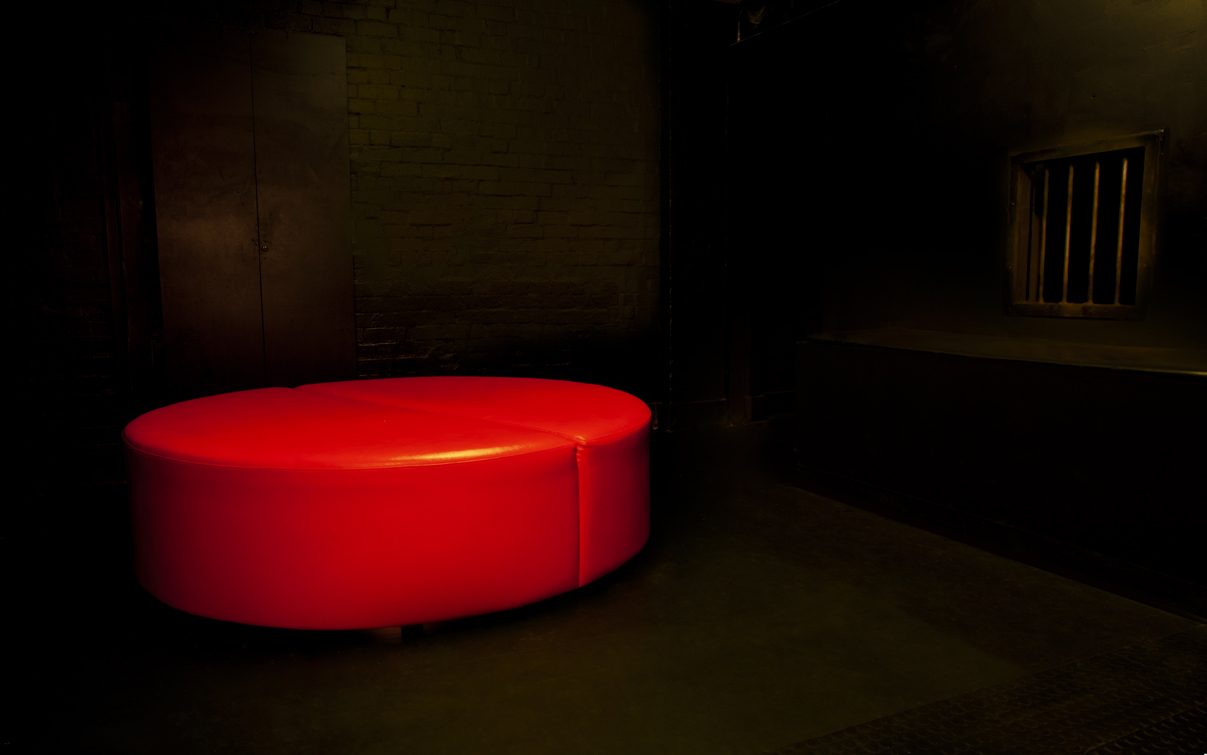 Sexy circular bed in the dark room.