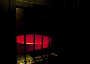 Sexy circular bed in the dark room.